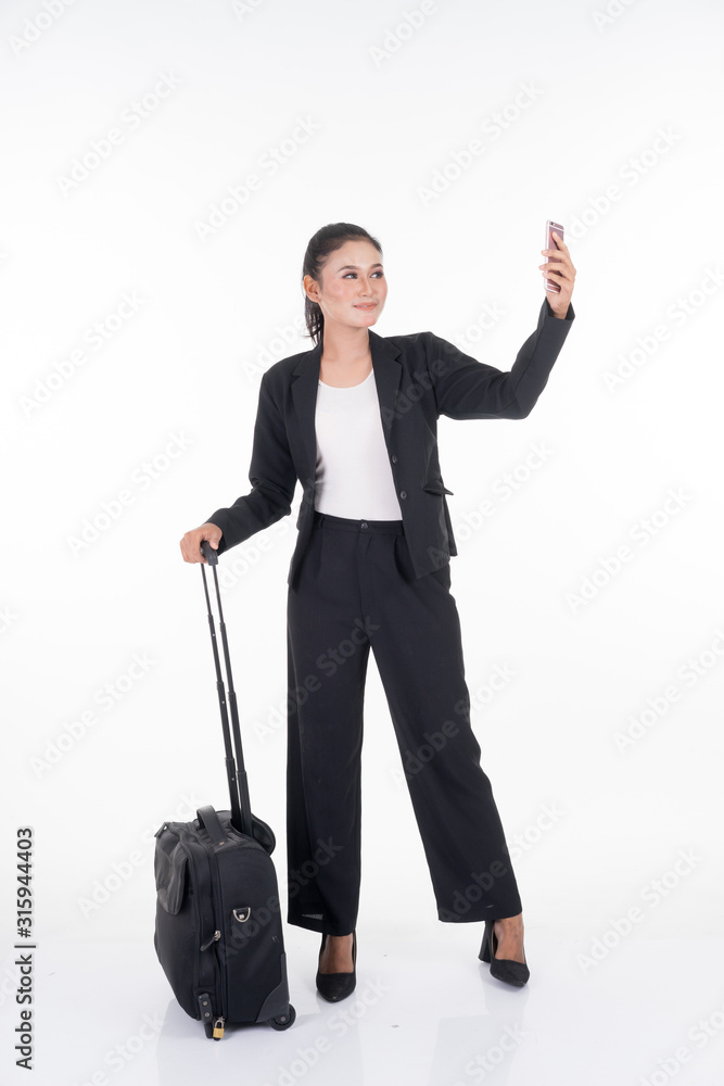 Businesswoman on a business trip, with luggage isolated on white background. Suitable for cut out, manipulation or composite works for travel or business concept. Businesswoman on a business trip, with luggage isolated on white background. Suitable for cut out, manipulation or composite works for travel or business concept.