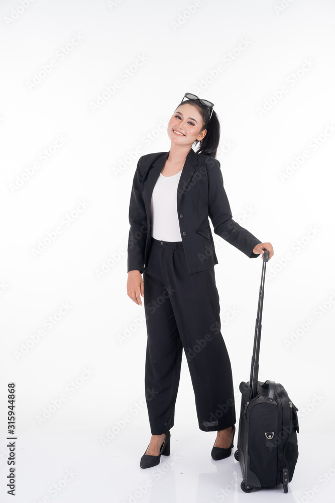 Businesswoman on a business trip, with luggage isolated on white background. Suitable for cut out, manipulation or composite works for travel or business concept. Businesswoman on a business trip, with luggage isolated on white background. Suitable for cut out, manipulation or composite works for travel or business concept.