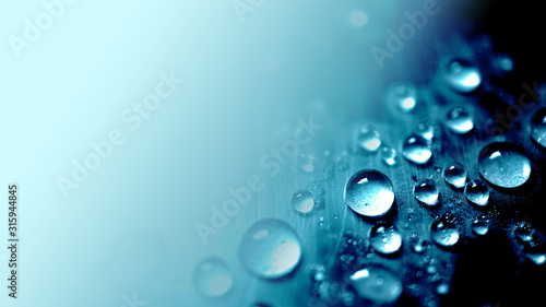 Photo vivid blue water drop texture background for cold , freshness and drinking conce