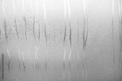 Glass with Condensate, Window with Steam and Water as Background or Texture