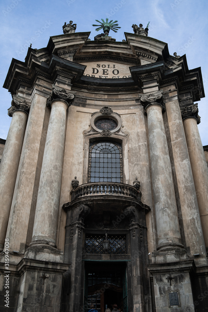 Fototapeta premium LVIV, UKRAINE - october 13, 2019: Dominican cathedral in Lviv. One of the most beautiful cathedrals in Lviv. Ancient monument - facade of medieval church. Vertical