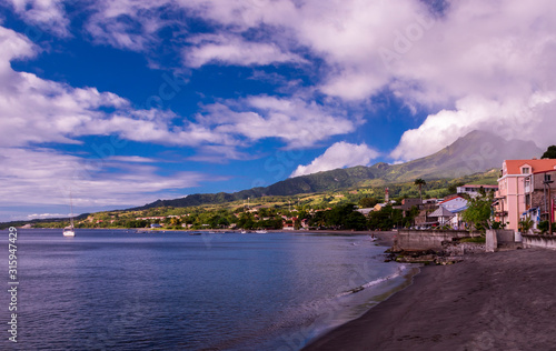 View of Saint-Pierre on Martinique island and Mount Pelee volcano at sunset