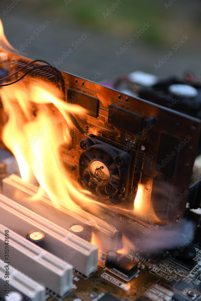 Fire Burning ,blazing computer motherboard, cpu,gpu and video card,  processor on circuit board with electronic Stock Photo | Adobe Stock