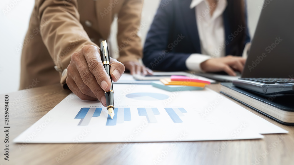 Business team brainstorming and discussing with financial data and report graph. Teamwork meeting working concept. Business team brainstorming and discussing with financial data and report graph. Teamwork meeting working concept.