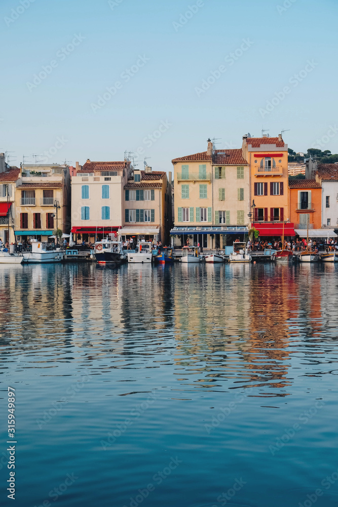 Colorful buildings and boats in the port of Cassis, France.