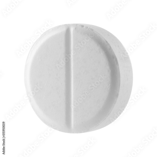 White round pill on a white isolated background. Big pill close-up.