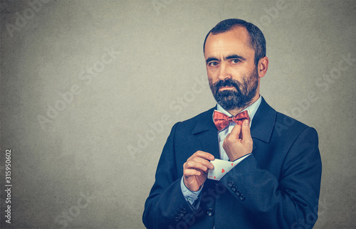 Canvastavla man pulling out a hidden ace card from suit jacket sleeve