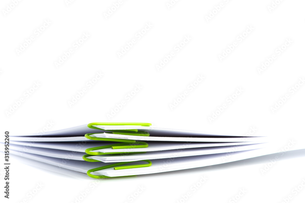 Pile of blank document with paper clip on white background Pile of blank document with paper clip on white background