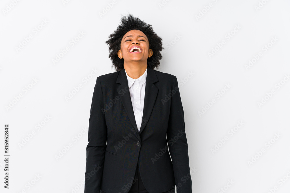Middle aged african american business woman against a white background isolated laughs and closes eyes, feels relaxed and happy. Middle aged african american business woman against a white background isolated laughs and closes eyes, feels relaxed and happy.
