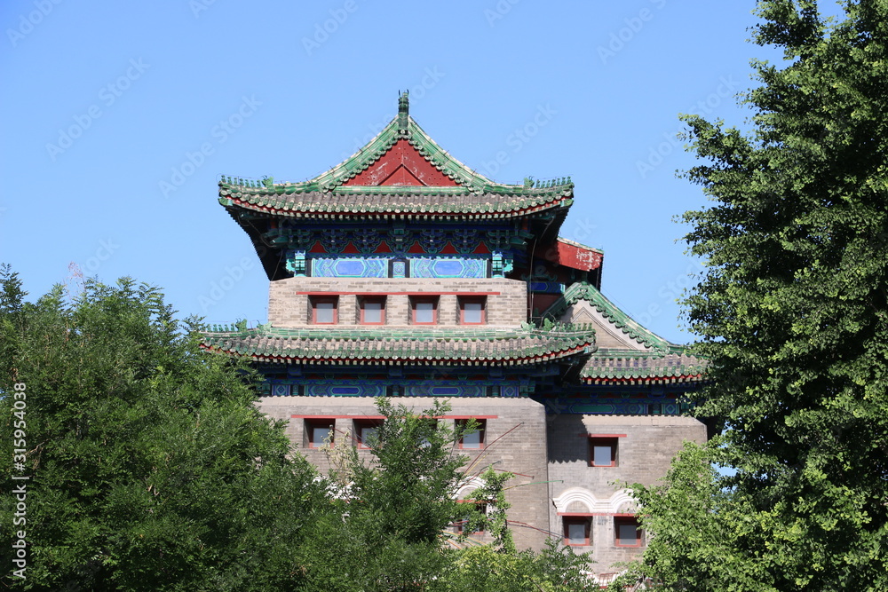 Archery Tower of Zhengyangmen behind trees on a summer day, Beijing (China) Archery Tower of Zhengyangmen behind trees on a summer day, Beijing (China)