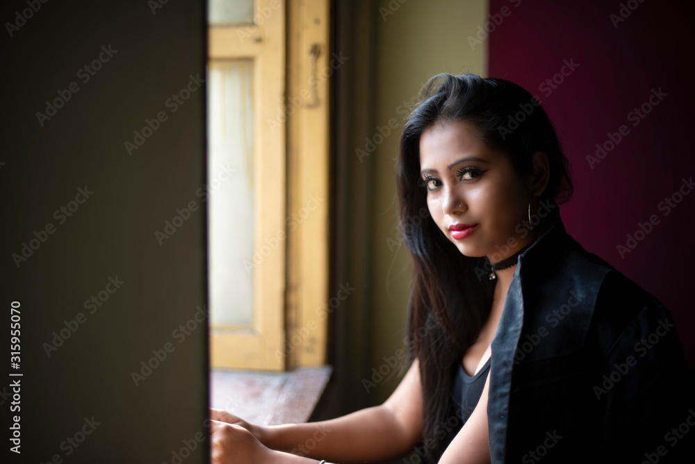 Fashion portrait of an young Indian Bengali brunette woman in