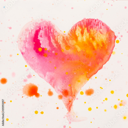 Watercolor painted pink heart  on the white watercolor paper.