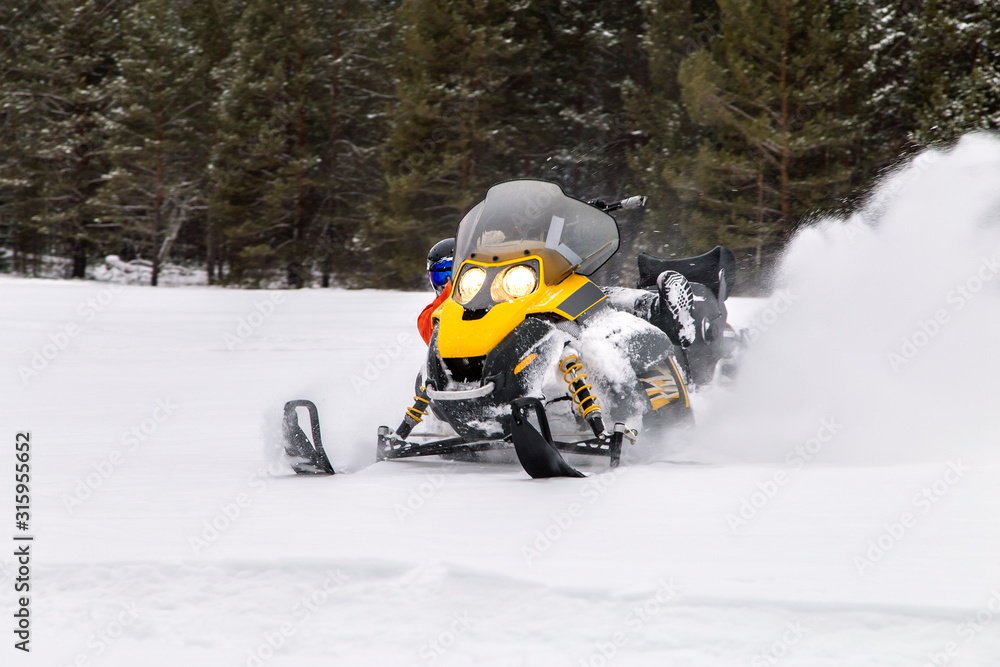 Athlete on a snowmobile.