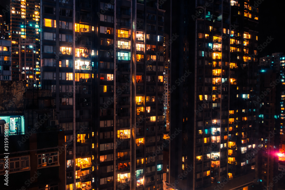 city lights of skyscraper buildings at night, downtown cityscape of hongkong at night