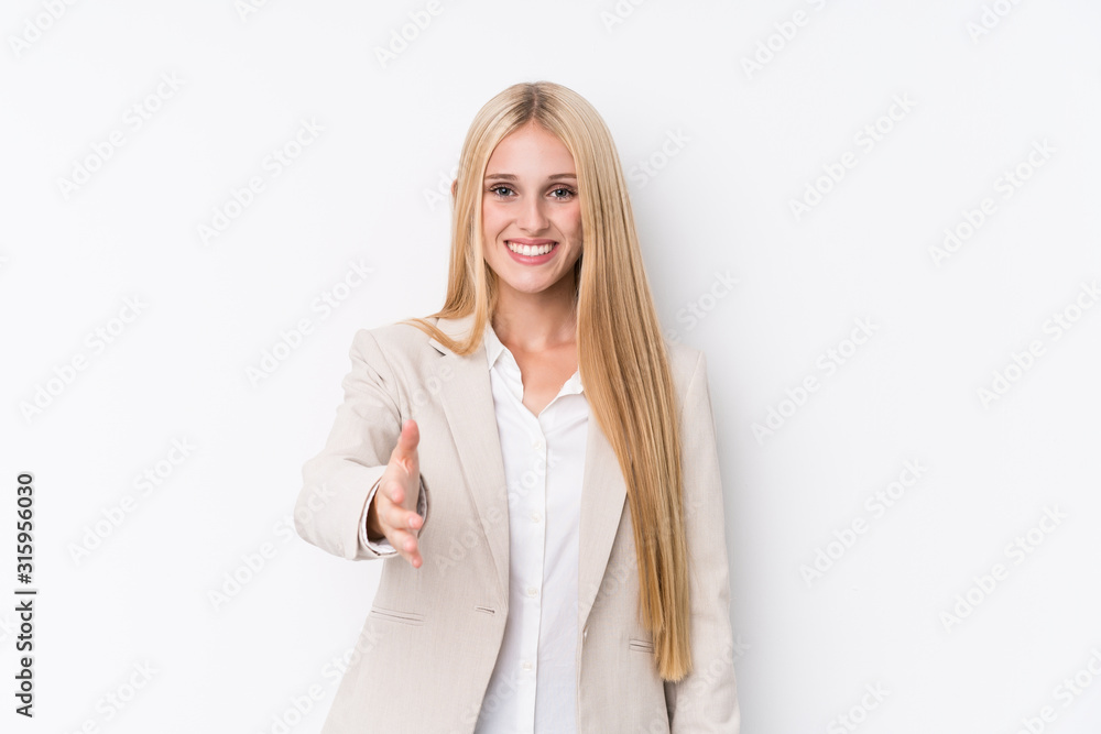 Young business blonde woman on white background stretching hand at camera in greeting gesture. Young business blonde woman on white background stretching hand at camera in greeting gesture.
