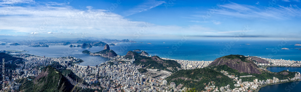 Panorama View of the Rio de Janeiro City, including the Sugar Loaf, seen from the Corcovado Mountain.