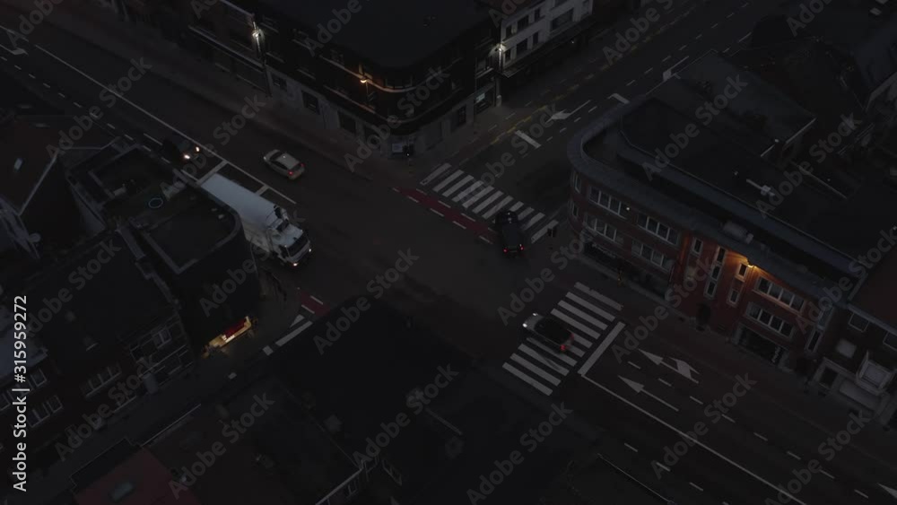Dark Intersection trafic before sunrise with cars driving Arial view Drone Dark Intersection trafic before sunrise with cars driving Arial view Drone