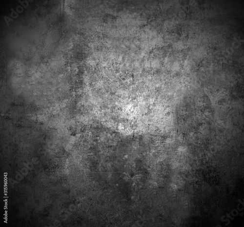 The scratched textured surface of the concrete wall is grey . Texture or background.