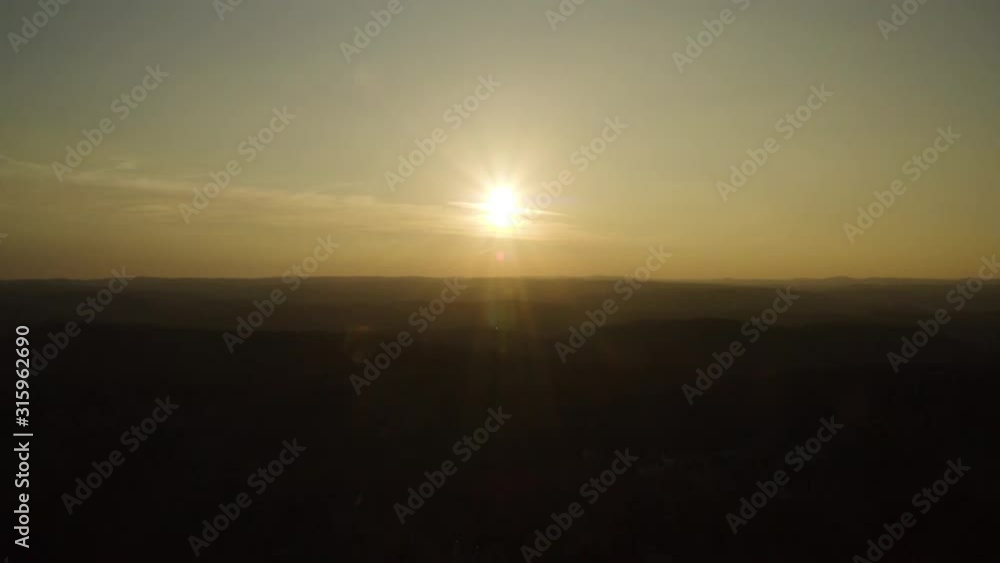 Anamorphic aerial view of sunset over hills Anamorphic aerial view of sunset over hills