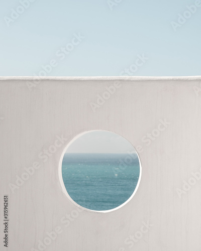 Wall with hole water and blue sky background. Creative, minimal, styled concept for bloggers.