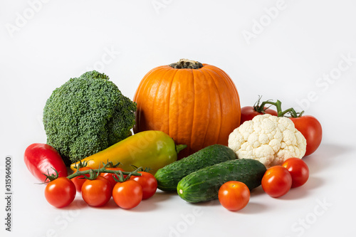 Healthy food concept. Vegetables on white background. Banner. Pumpkin, tomatoes, cucumbers, peppers, cauliflower and broccoli. © miss.lemon