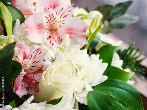 Macro photography of the bouquet of white chrysanthemums and pink alstroemeria. Floral pattern. Full of love flowers concepts. Beauty in nature. Suitable as background, greeting cards, template