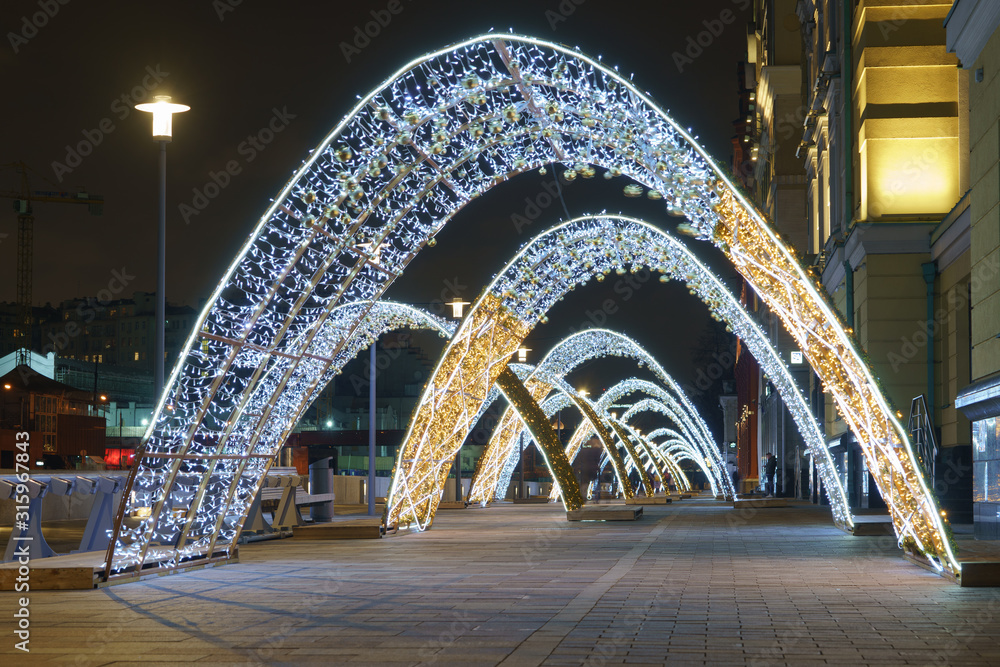 Long exposure photography of Christmas decoration, street lanterns in Moscow. Right geometrical forms. Concepts of festive city decoration. Beauty of the capital in the winter night. 