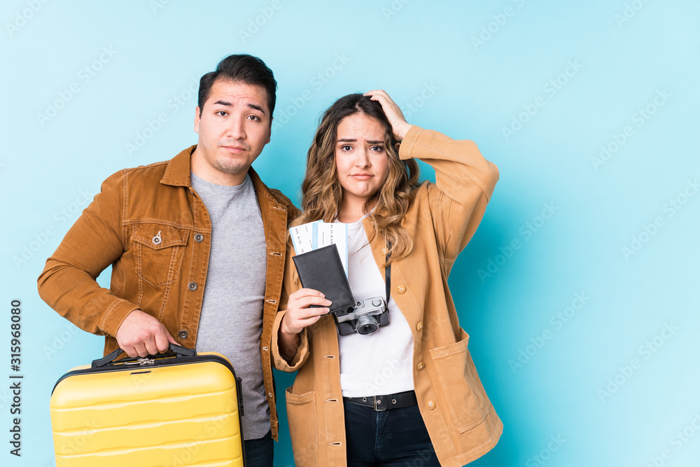 Young couple ready for a travel isolated being shocked, she has remembered important meeting.