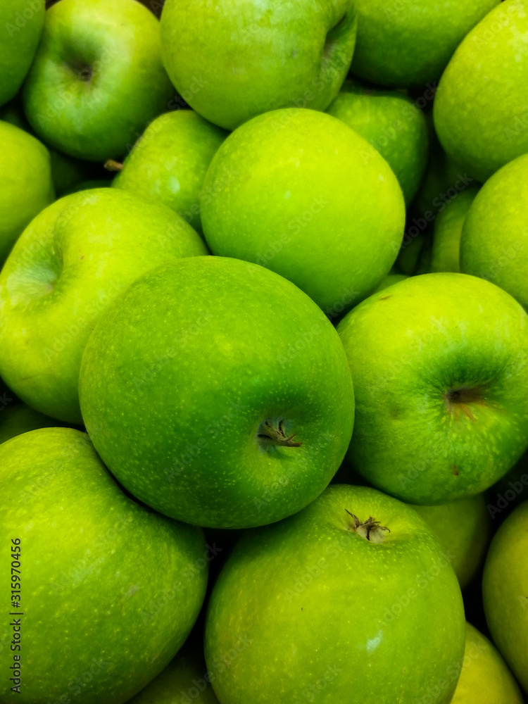 green apples on black background green apples on black background