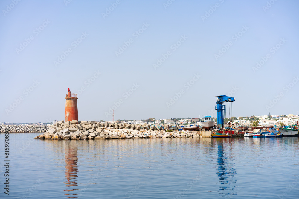 lighthouse in harbor