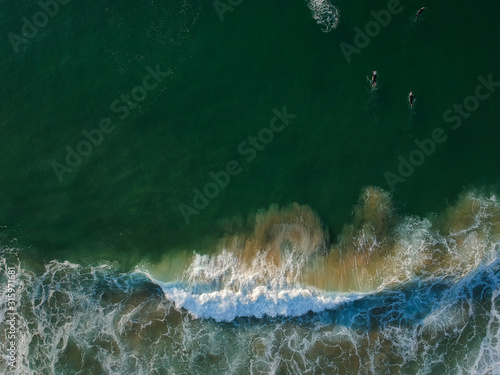 aerial view from a big wave crashing in a beach. Drone view © nvphoto