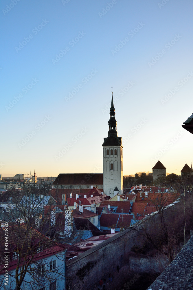 Naklejka premium View of the Church of Niguliste in Tallinn on a winter evening