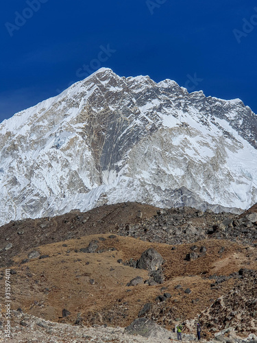 Picturesque view on snow-capped Nuptse fron the top of the hill near Lobuche village. Everest base camp trek: from Dzongla to Lobuche, Solokhumbu, Nepal. photo