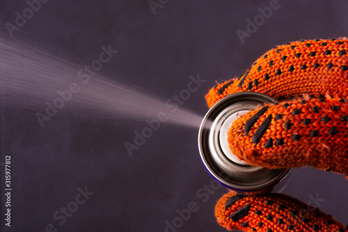 Aerosol can. Multi use product protects metal from rust and corrosion. View from above. photo