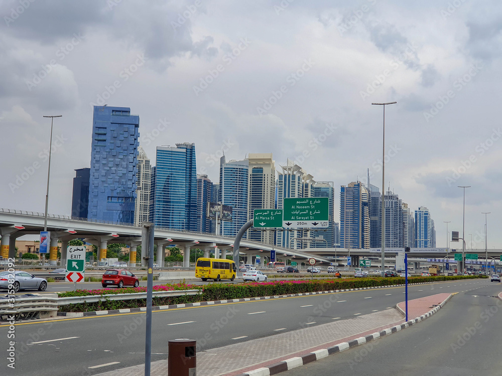 DUBAI, UAE - NOVEMBER 2019: Tecom distric with its fantastic skyscrapers, green parks and cozy cafes.