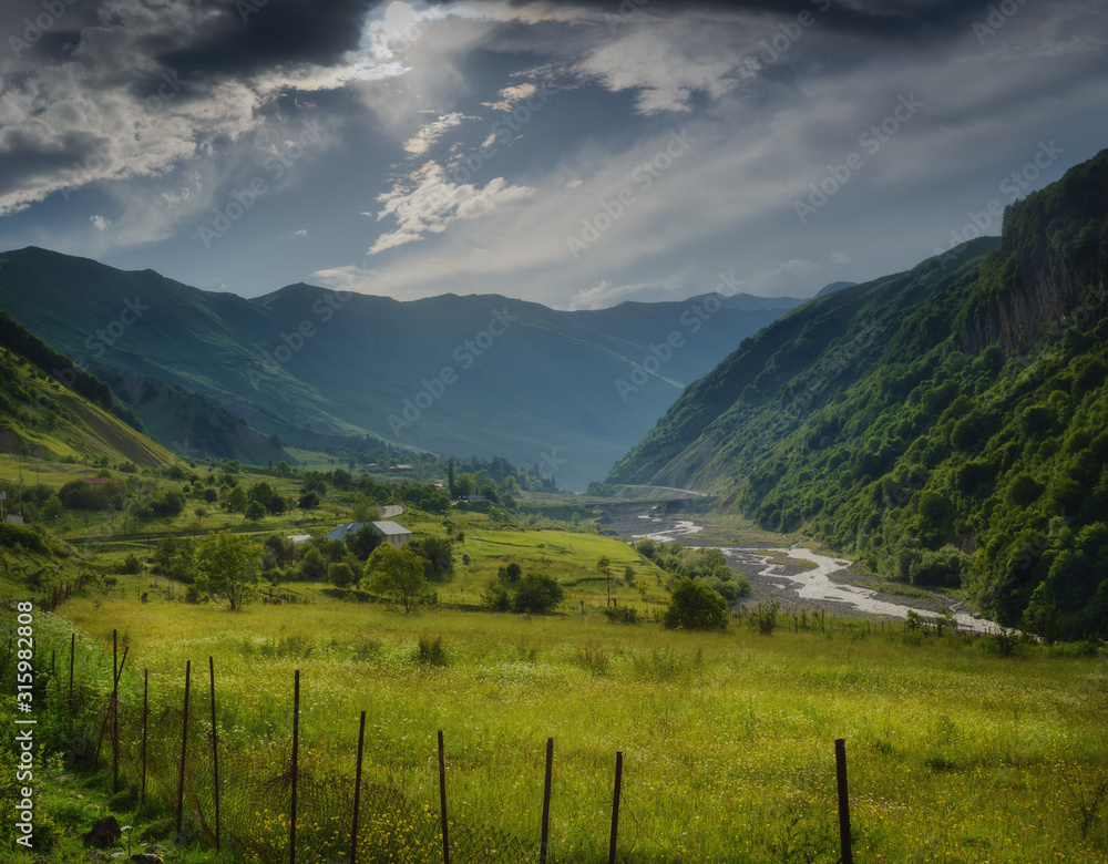 Mountain valley flooded with soft sunlight. Relaxing landscape