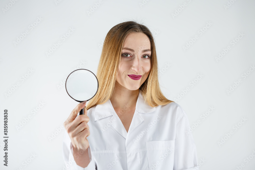 Female doctor with a magnifier in hands Female doctor with a magnifier in hands