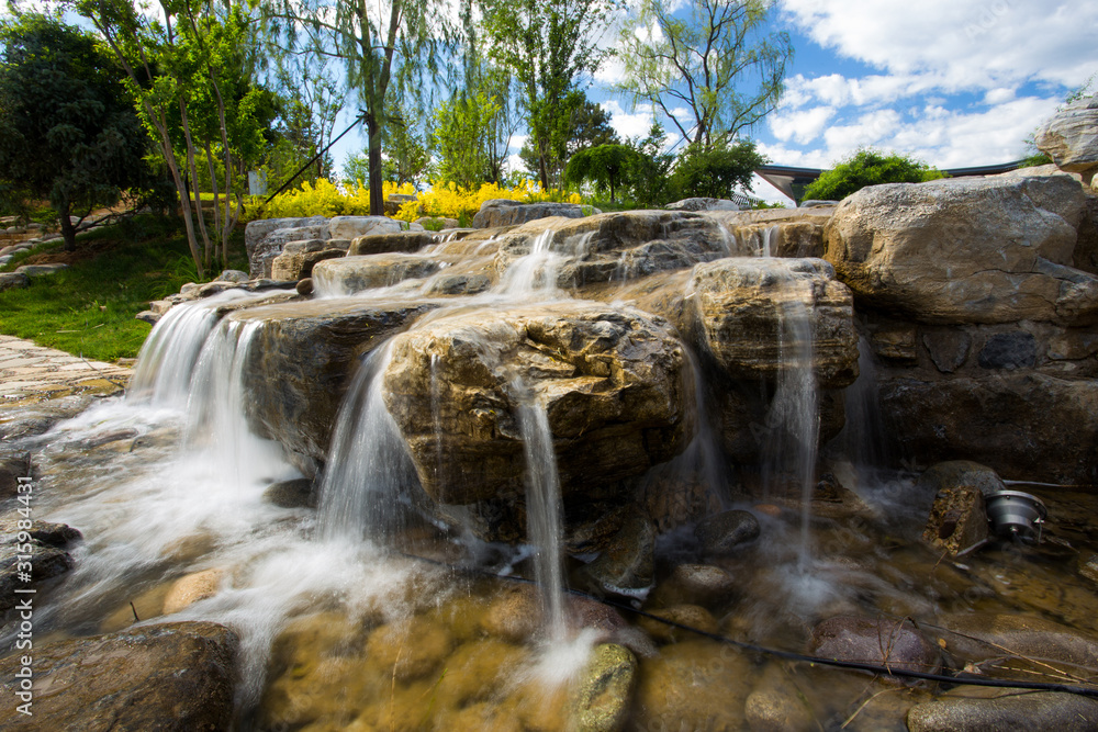 Naklejka premium Long exposure decorative waterfall.
