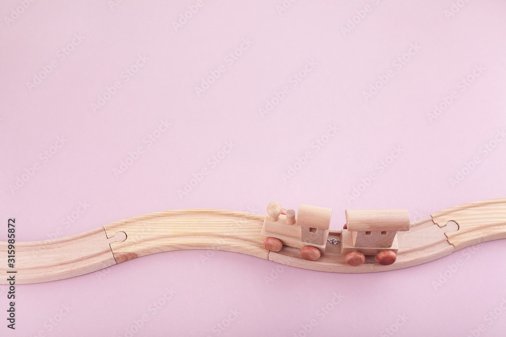 Zero waste. Eco wooden toys on pink background. Top view Zero waste. Eco wooden toys on pink background. Top view