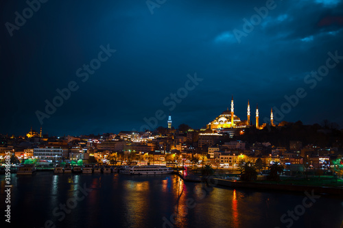 Suleymaniye Mosque view from Golden Horn during twilight with amazing lights and colors