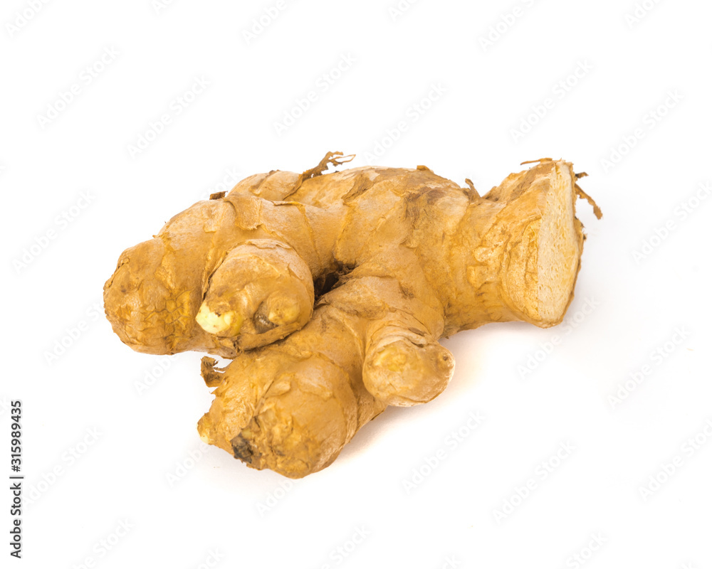 Studio shot organic homegrown single ginger root isolated on white