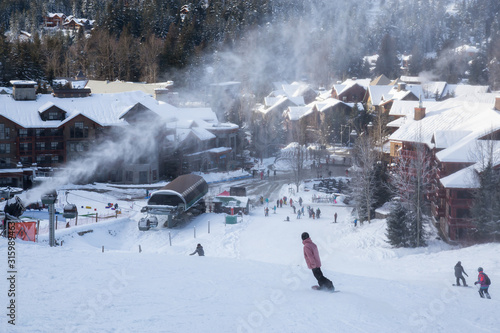 View from above of Creekside Village during a sunny winter day. Taken from Whistler Mountain, British Columbia, Canada. photo