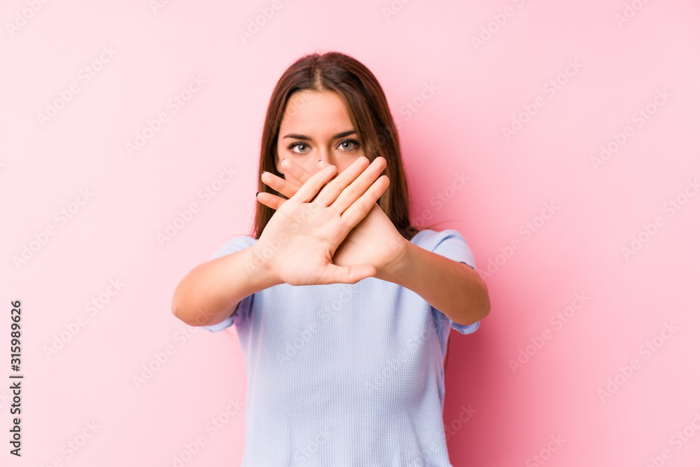 Young caucasian woman wearing a ski clothes isolated doing a denial gesture Young caucasian woman wearing a ski clothes isolated doing a denial gesture