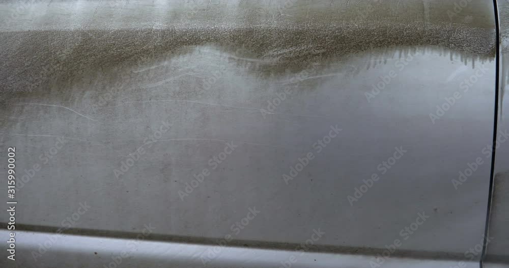 Manual wash for perfect clean car. Cleaning car using high pressure water, Man cleaning vehicle with high pressure water spray or jet. Car wash details, Close up concept. Manual wash for perfect clean car. Cleaning car using high pressure water, Man cleaning vehicle with high pressure water spray or jet. Car wash details, Close up concept.