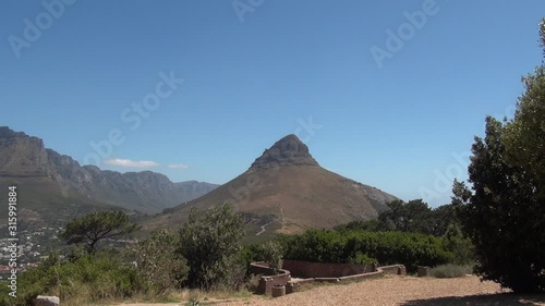 HD high quality sunny day video of spectacular scenic Lion's Head mountain in Table Mountain National Park from upper Signal Hill view point in Western Cape, Cape Town, South Africa