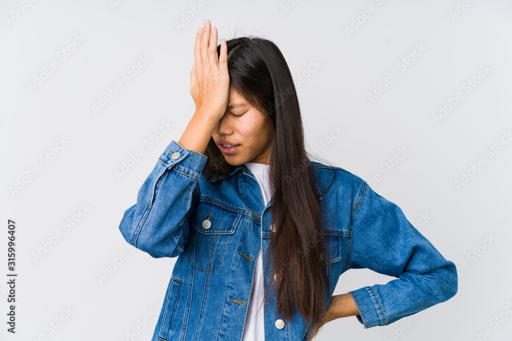 Young asian woman forgetting something, slapping forehead with palm and closing eyes. Young asian woman forgetting something, slapping forehead with palm and closing eyes.