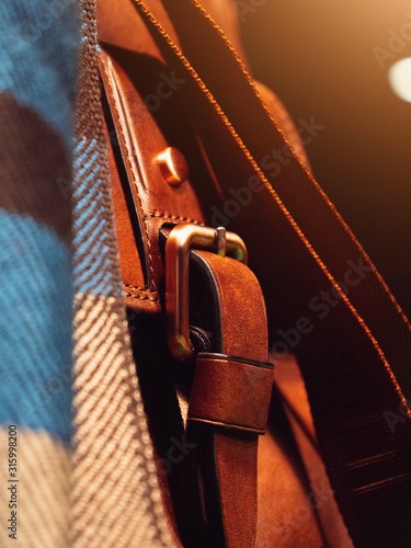 brown business men's leather bag on the pool table