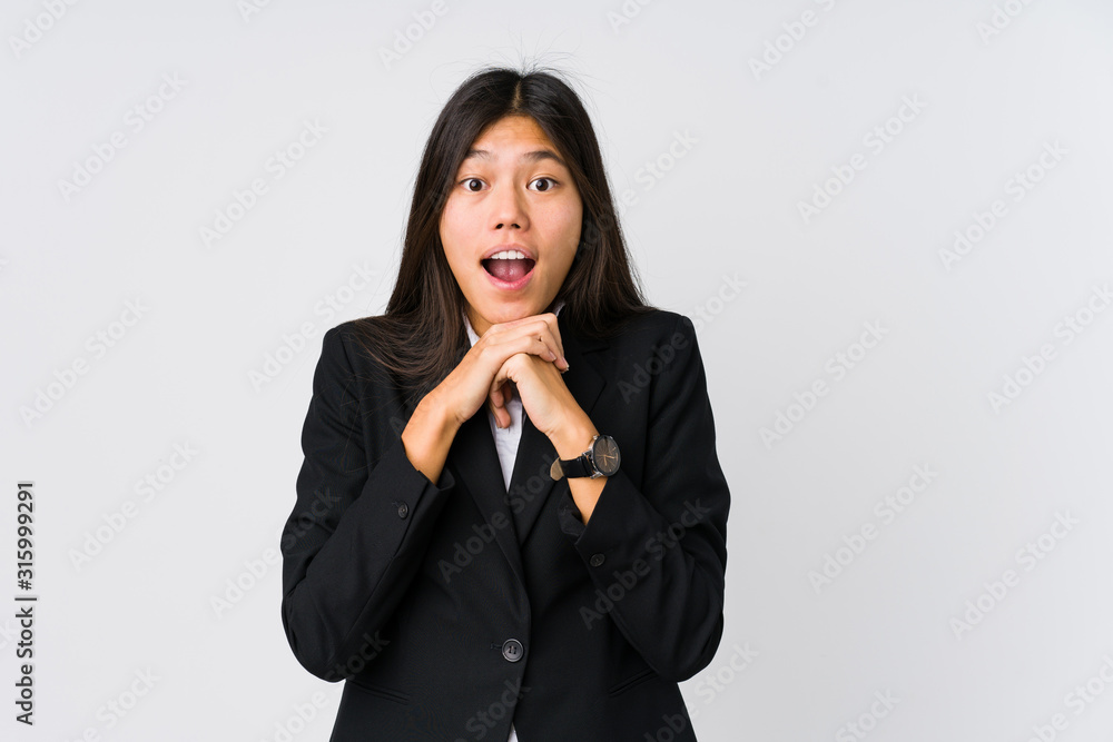Young asian business woman praying for luck, amazed and opening mouth looking to front. Young asian business woman praying for luck, amazed and opening mouth looking to front.