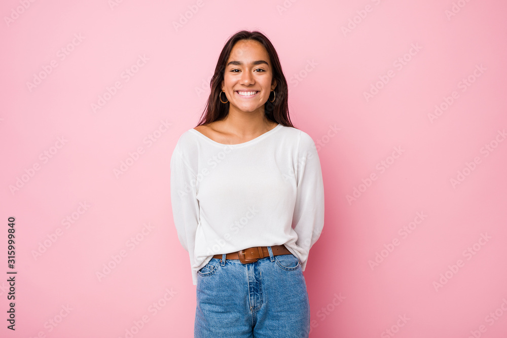 Young mixed race indian woman happy, smiling and cheerful. Young mixed race indian woman happy, smiling and cheerful.