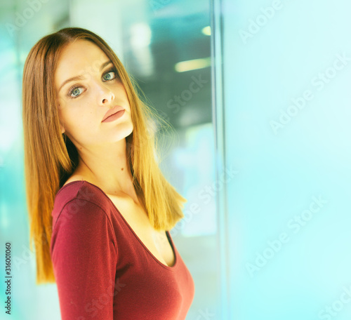 Konstfotografi Neon light glows on beautiful red head model